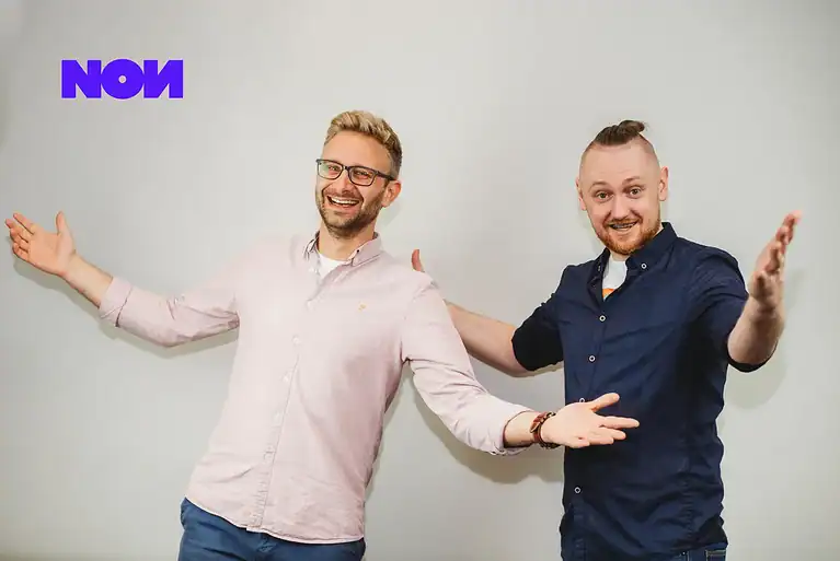 Rafał Moszkowcow Chomsky with a non.agency colleague, welcoming gesture towards the camera