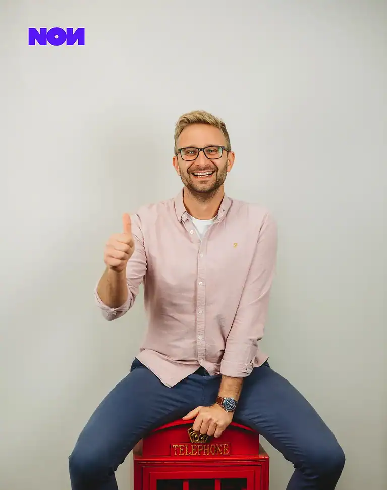 Rafał Moszkowcow Chomsky, International SEO Specialist at non.agency, standing portrait in a white shirt